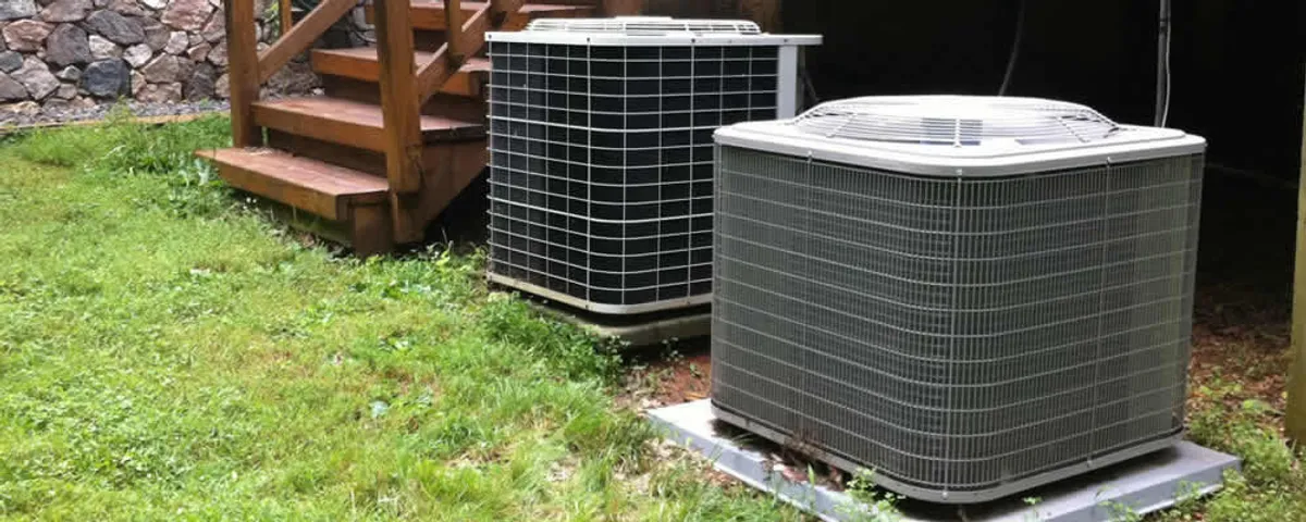Heat pump installation and service units outside a home in Newton, MA